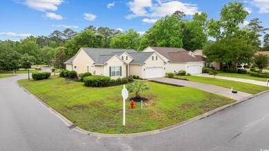 View of front facade with concrete driveway, a fro