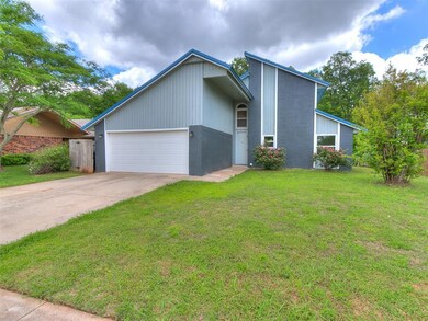 Mid-century modern home featuring brick siding, dr