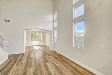 Entryway featuring a high ceiling, visible vents,