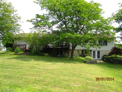 Rear of home -showing walkout on the right w/Frenc