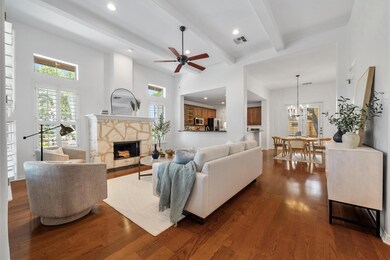 Living room featuring dark wood-style floors, hea