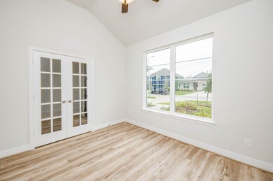The study features elegant French doors, adding a