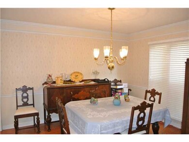 Formal dining room with chair rail, crown molding 