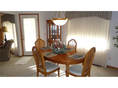 formal dining off kitchen & great room, door to covered patio