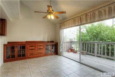 Dining area has built in credenza and ceiling fan/