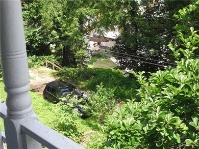 View. From covered front porch, high above South H