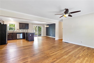 Unfurnished living room featuring light wood-style