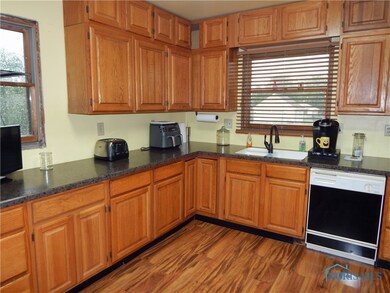 Oak cabinets with new faucet, all appliances stay.