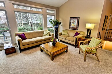 Great room with picture windows providing natural 