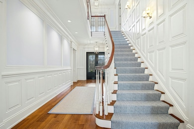 Enter into the sun drenched grand foyer with sweep