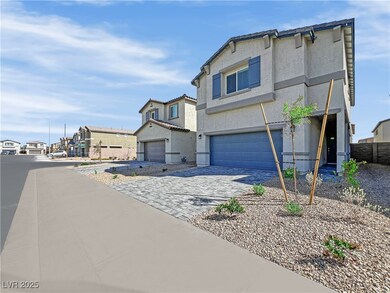 View of front facade featuring stucco siding, a ga