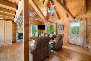 Living area featuring light wood-style floors, bea