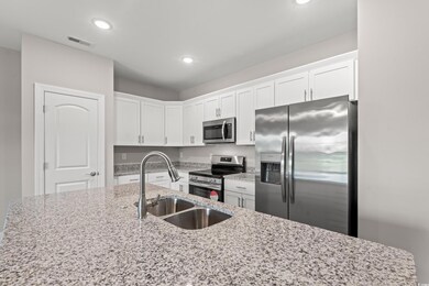 Kitchen featuring sink, appliances with stainless 