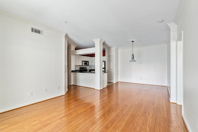 Spacious living room with wood flooring, ideal for