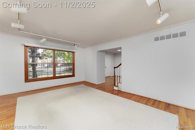 Living room with large picture window, lots of light .