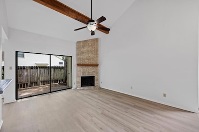 Unfurnished living room featuring high vaulted ce