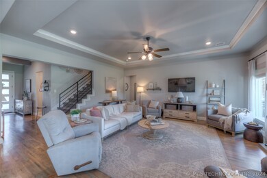 Living room with a gorgeous tray ceiling.