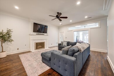 Living room with, a fireplace, custom 5 step 12