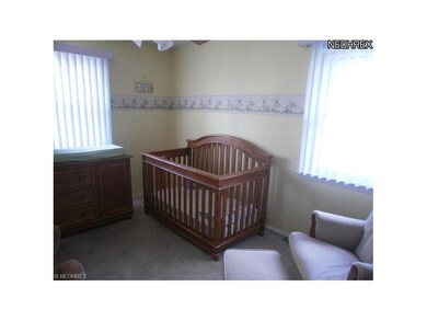 Another bedroom with hardwood floor, wall to wall 