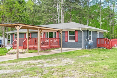Single story home with a front yard, brick siding,