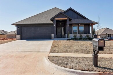 View of front facade featuring a garage