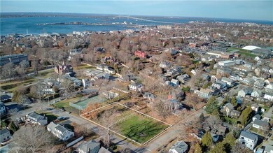 Picture of lots with Newport Bridge in background.