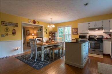 Very nice updated kitchen with stainless steel appliances, wood floors and crisp white cabinets galore!!