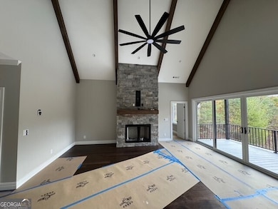 Living Room with vaulted ceiling and fireplace.