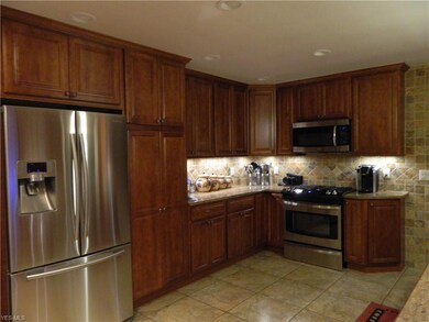 The floor to ceiling custom cabinetry, large ceram