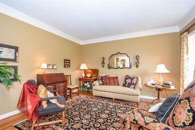 Living room with wood floor and crown molding