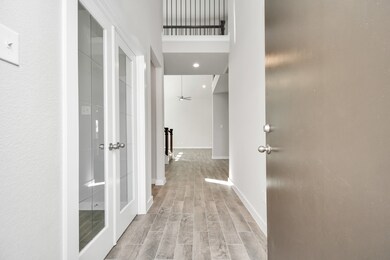 The grand entrance beckons with high ceilings, ado