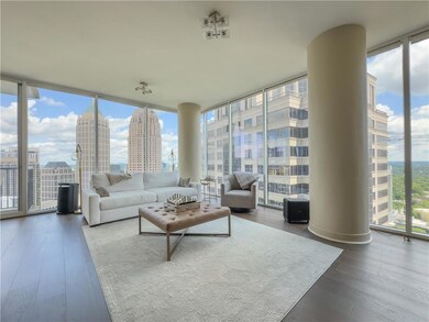 Living room featuring floor to ceiling windows, pl