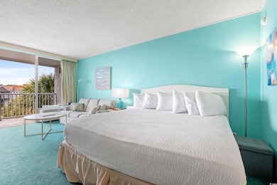 Carpeted bedroom featuring a textured ceiling