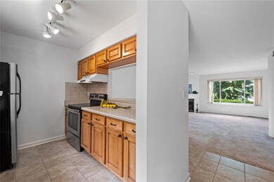 Sunny kitchen opens into your spacious, open concept living area.