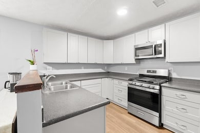 The kitchen is huge with stainless steel appliances and an abundance of cabinet and counter space!