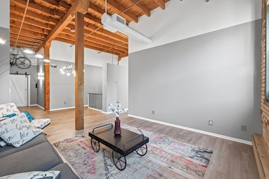 This wall is the perfect spot for a TV & entertainment center.  Lots of natural light with two windows