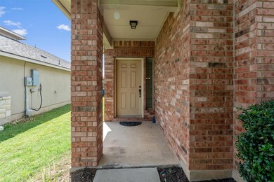 Property entrance with brick siding
