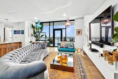 Living room with recessed lighting, baseboards, w