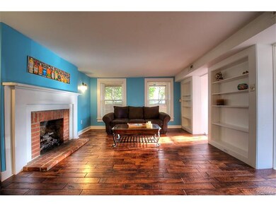 Living room also features sconce lighting and gas 