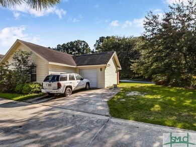 Garage and driveway off of lane behind the home.