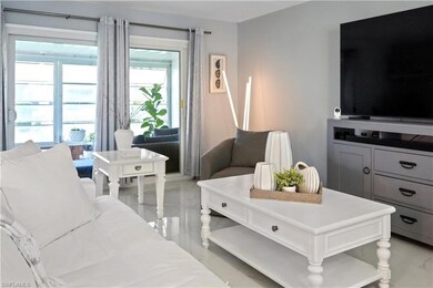 Living room featuring marble finish floor