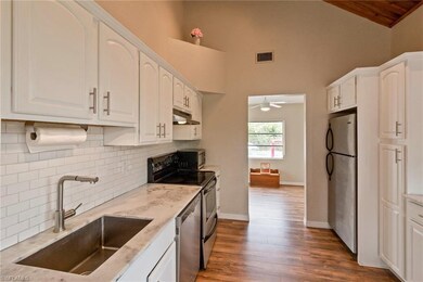 Kitchen with Marble counter tops with subway back-