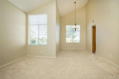 Spacious living and dining room area with vaulted 