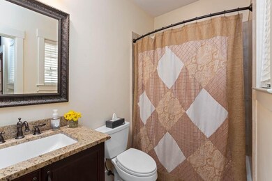 Full Bath downstairs across from Office/Guest Room