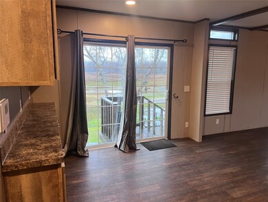 Dining area with sliding glass doors leading to ba