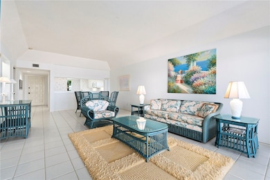 Living area with light tile patterned flooring
