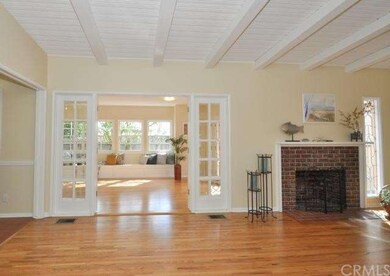 Enter through these beveled edged French doors to 