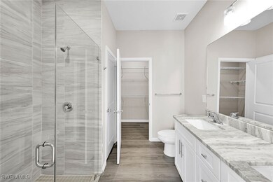 Bathroom with hardwood / wood-style floors, vanity