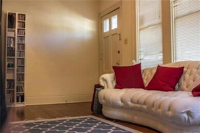 Living area featuring wood finished floors and ba