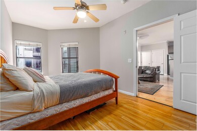 Bedroom with light wood-style floors and a ceilin